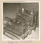 54027